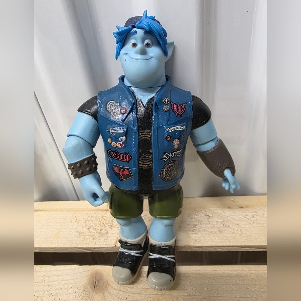 Disney Pixar Blue and Black Action Figure with Green Pants